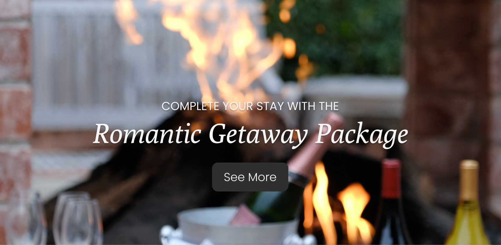 Fire closeup with wine in the foreground Romantic Getaway Text